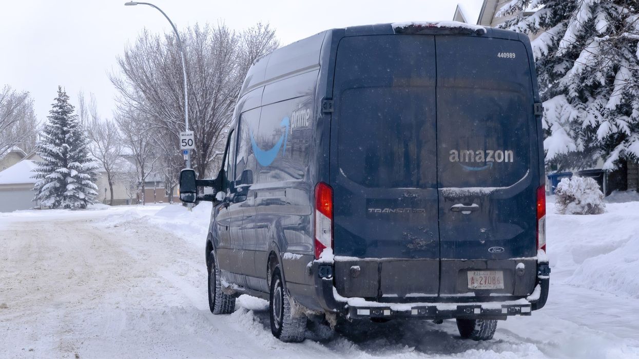 Amazon Prime delivery truck on a street during winter.