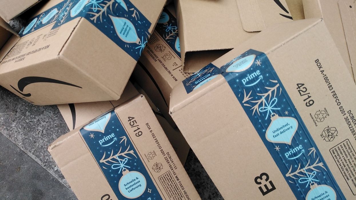 Amazon Prime packages with holiday-themed tape.