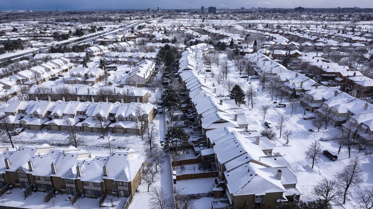 An aerial view of roofs in Ontario covered with snow.