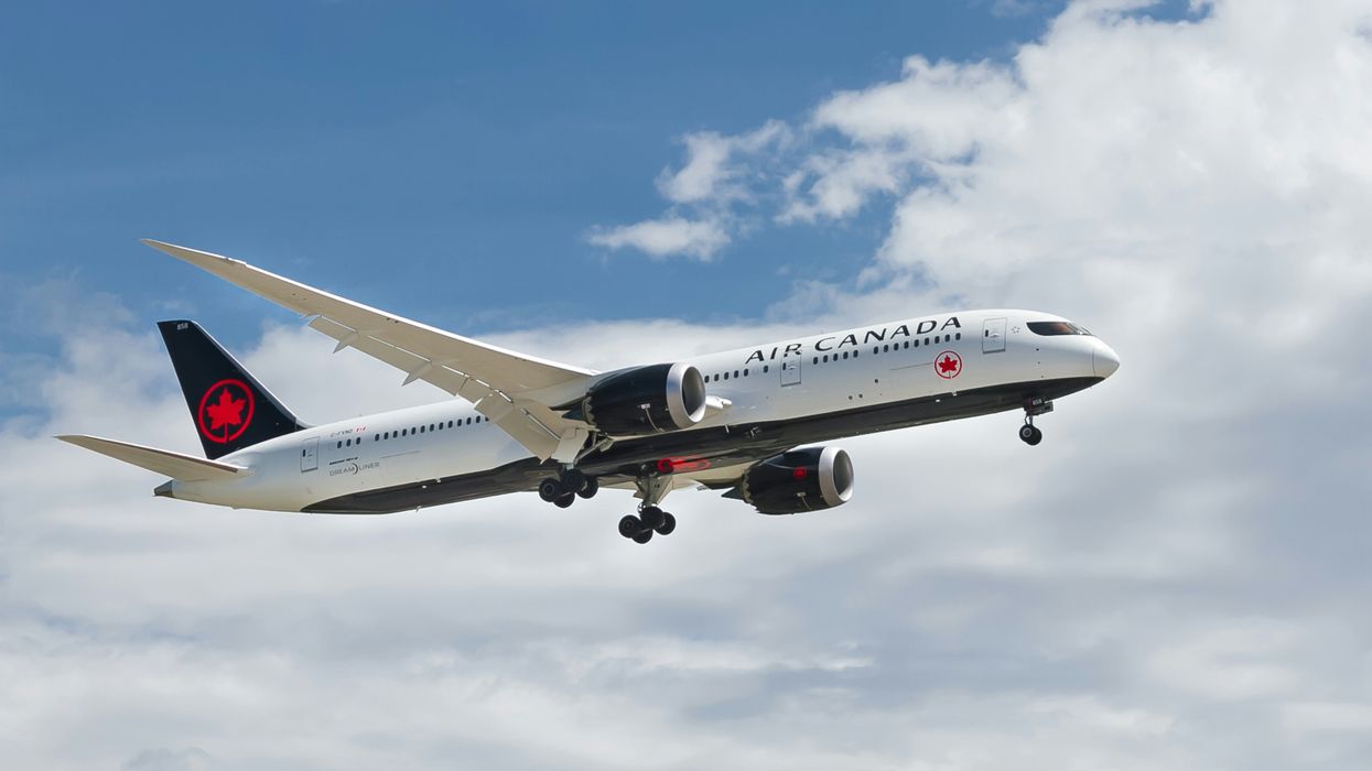 An Air Canada plane in the sky.