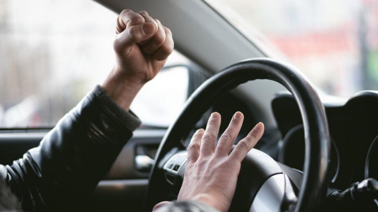 An angry driver at the wheel.