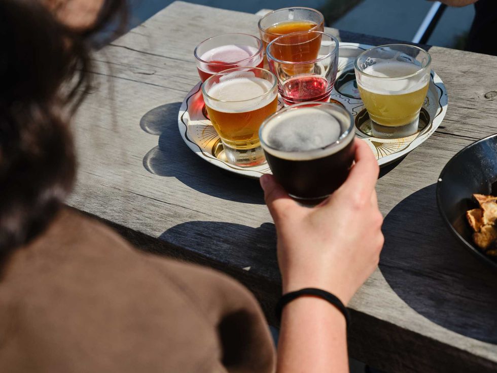An assortment of different drinks arranged on a tray.