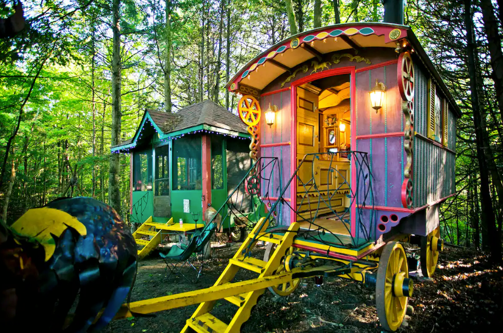 An Authentic Romani Caravan In Swaying Cedars.