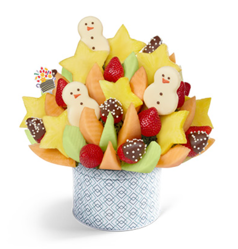 An edible arrangement made of fruit and chocolate.