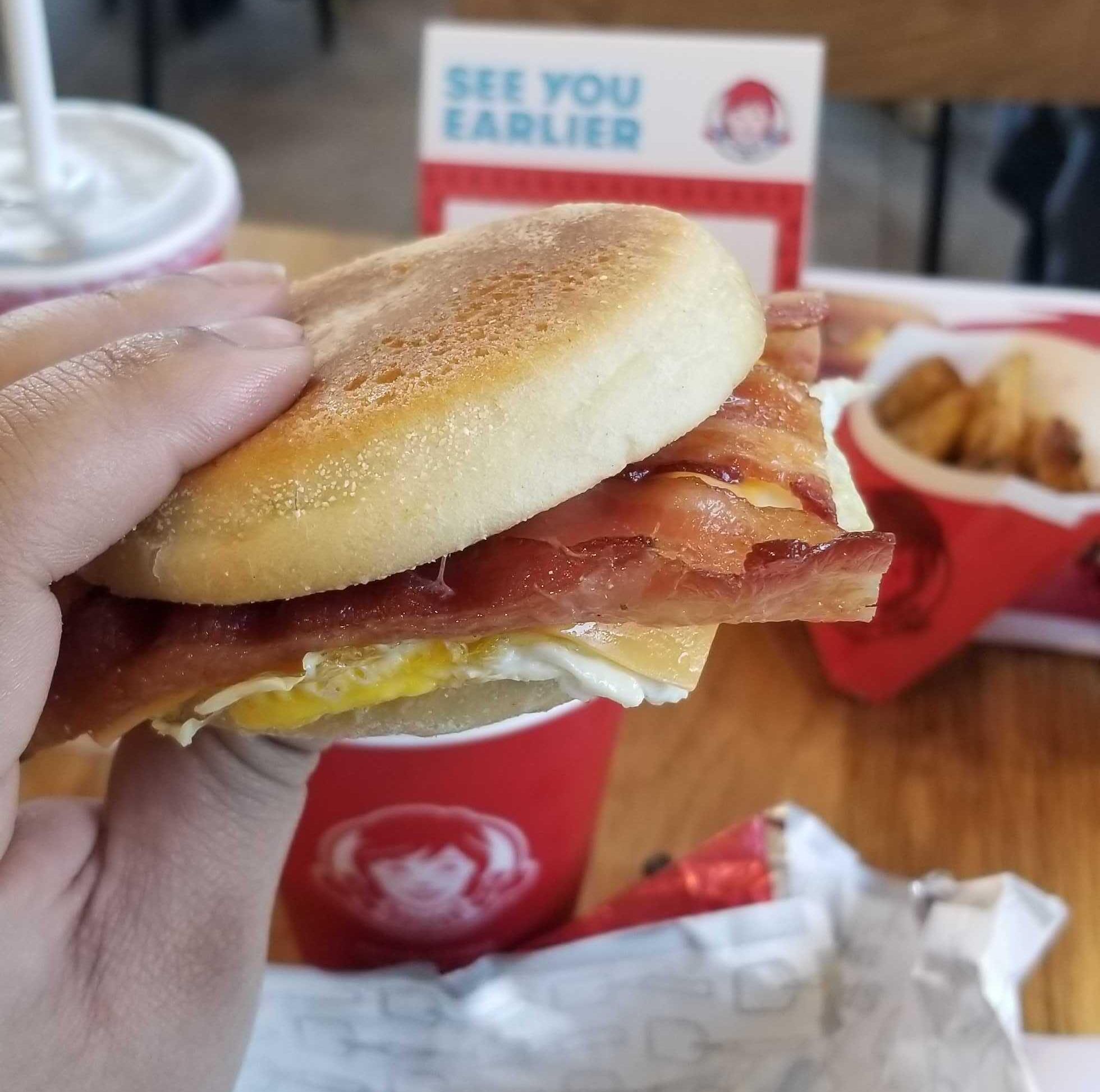 An egg, smoked bacon, and cheese sandwich.