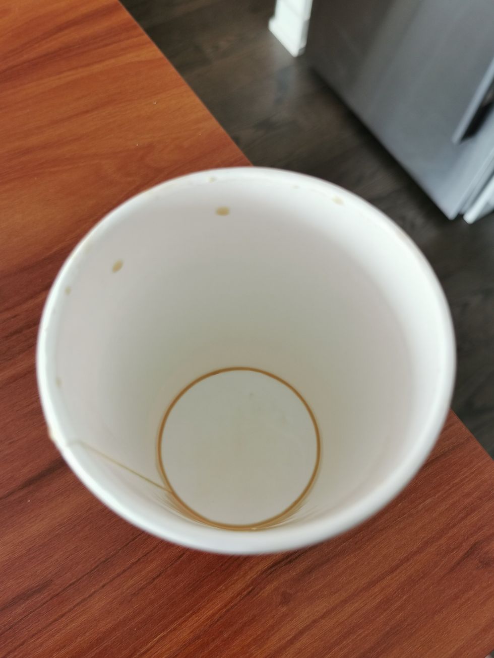 An empty Tim Hortons cup.