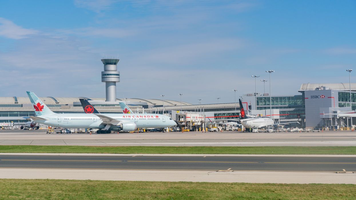 An exterior view of Toronto Pearson International Airport with Air Canada planes outside.