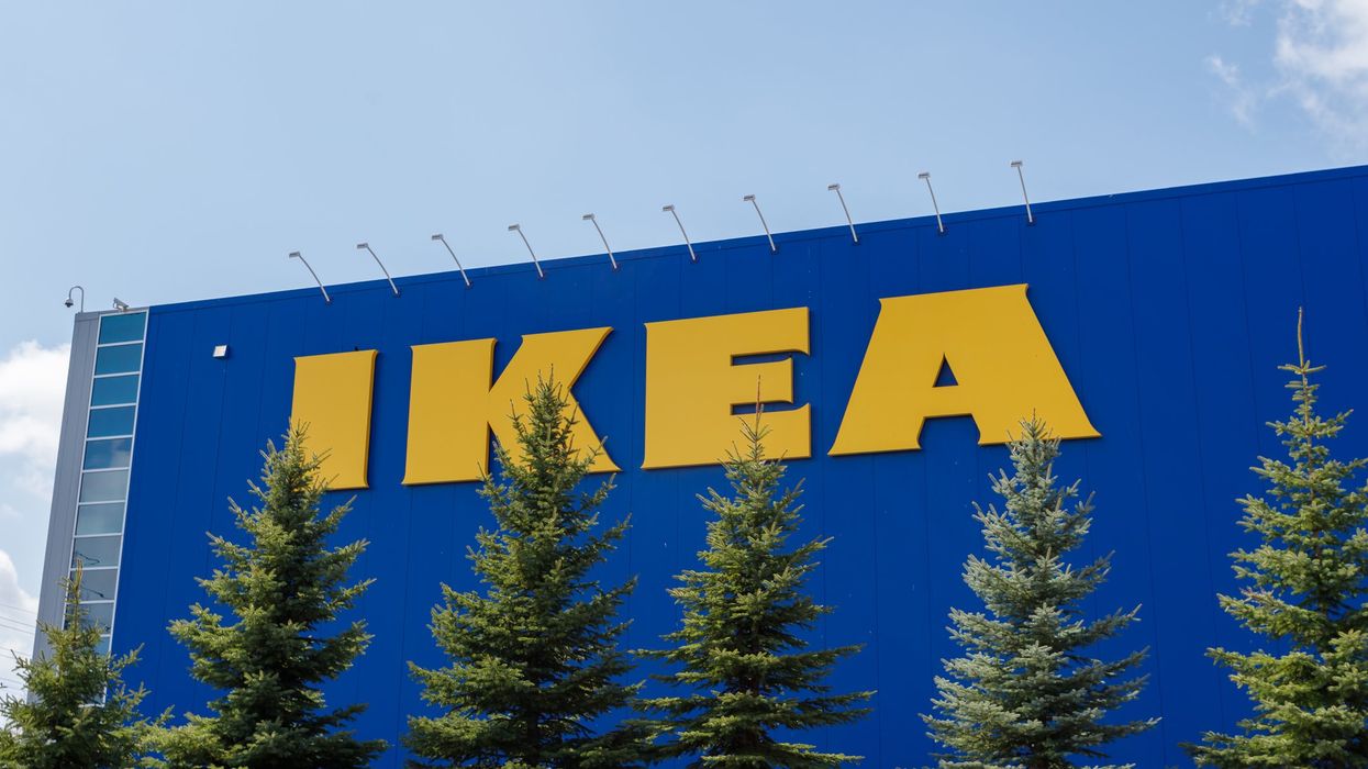 An IKEA Canada store with six large trees in front of it.