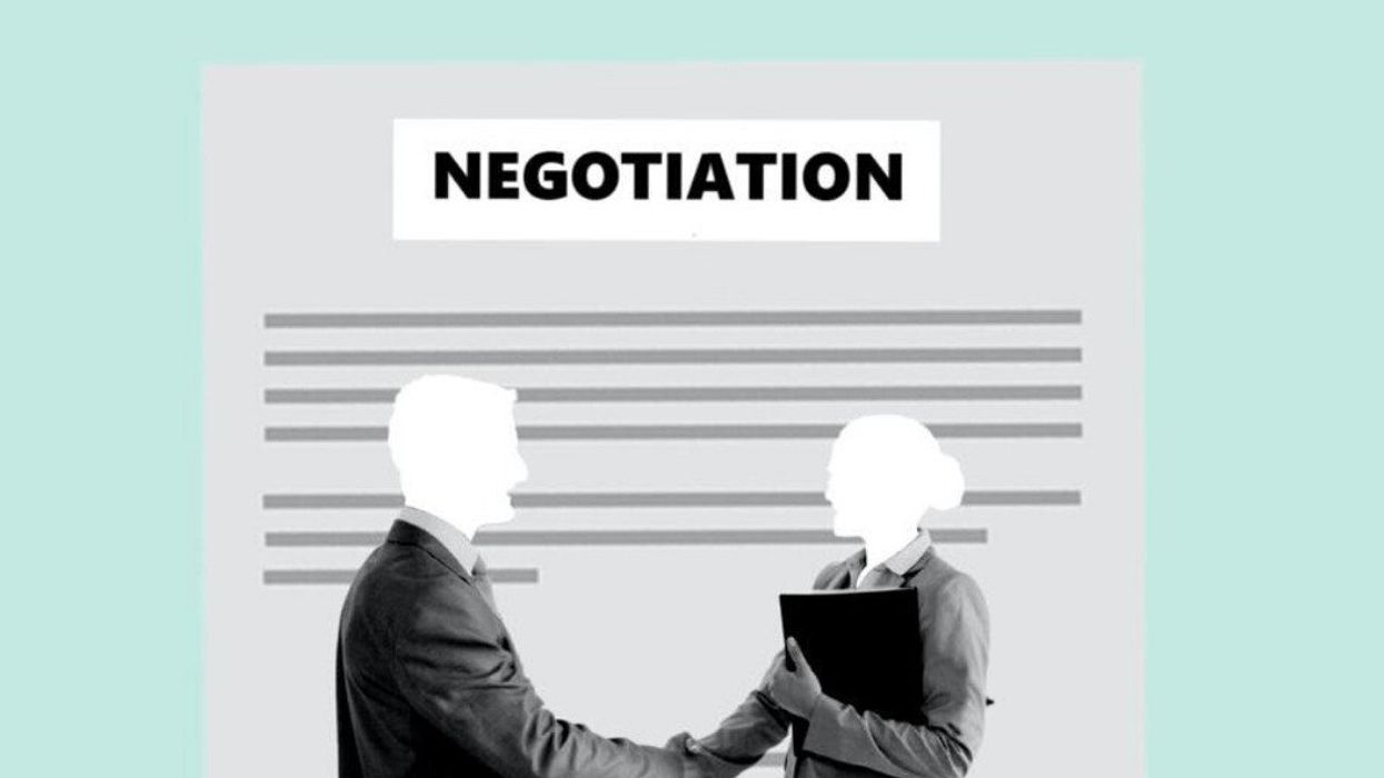 An illustration of business partners shaking hands during a negotiation.