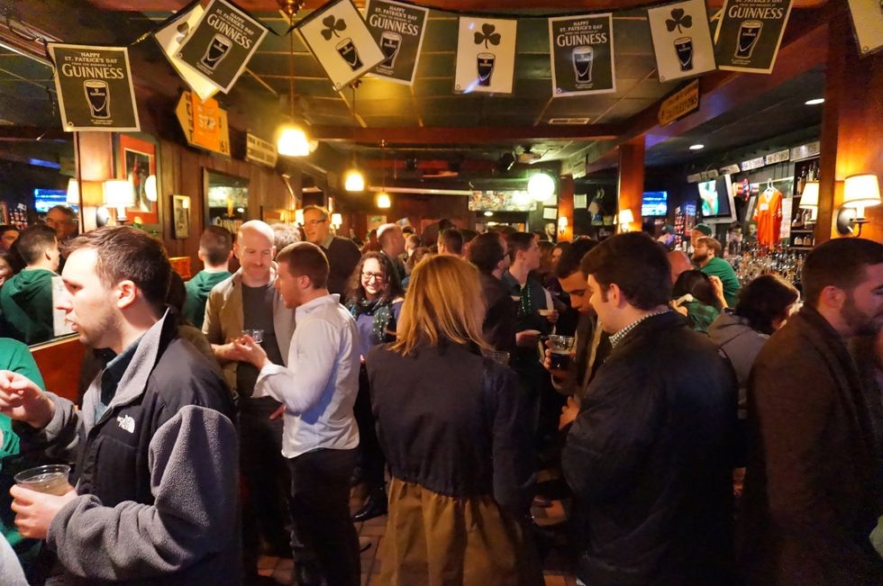 An Irish pub packed with people on St. Patrick's Day.