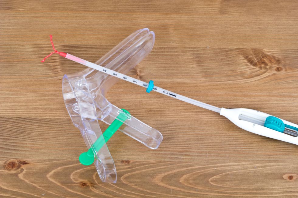 An IUD and speculum.