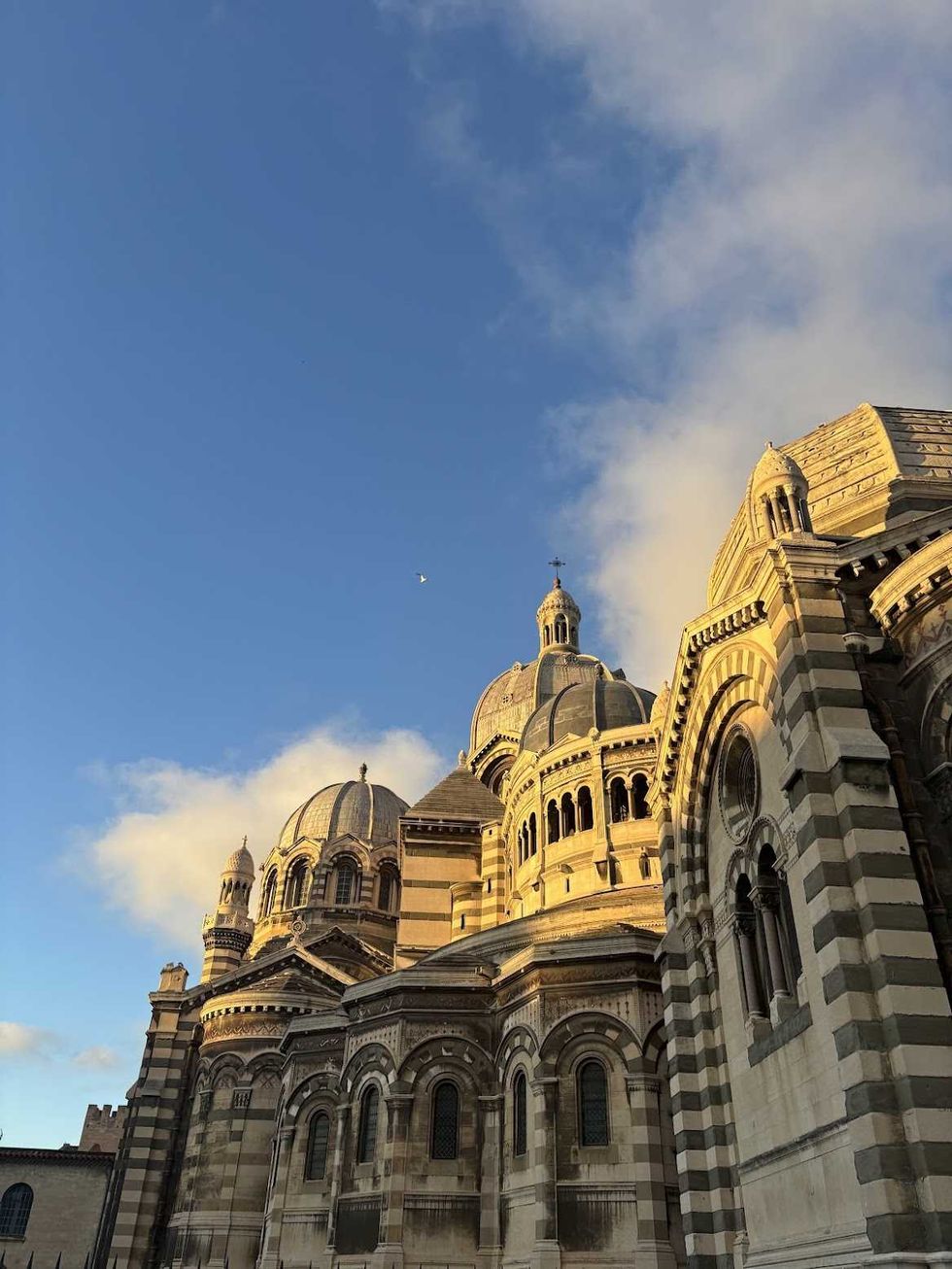 An old beautiful building against a sky with clouds.