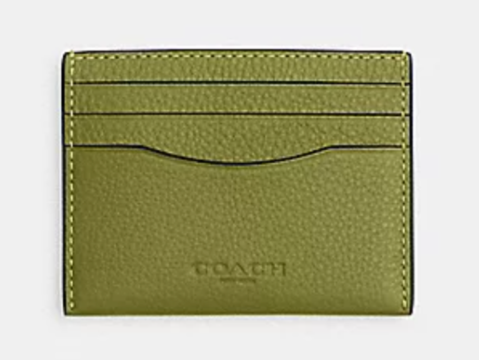 An olive green Coach ID card case.