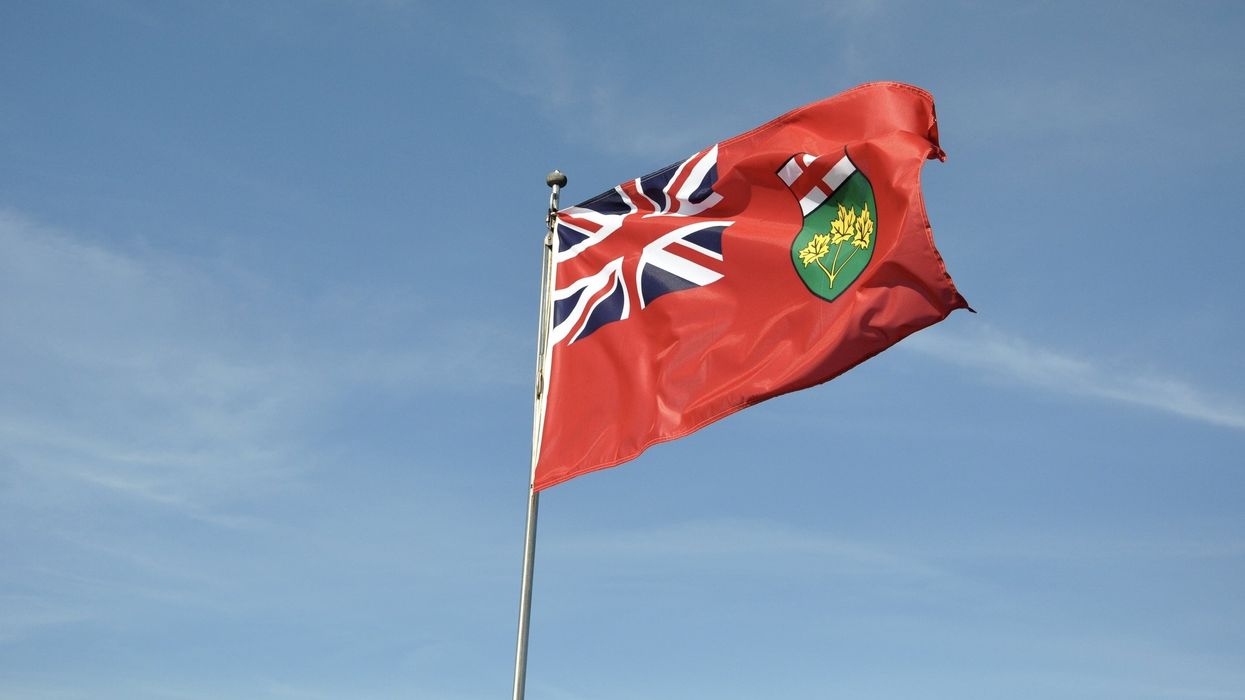 An Ontario flag blows in the breeze.