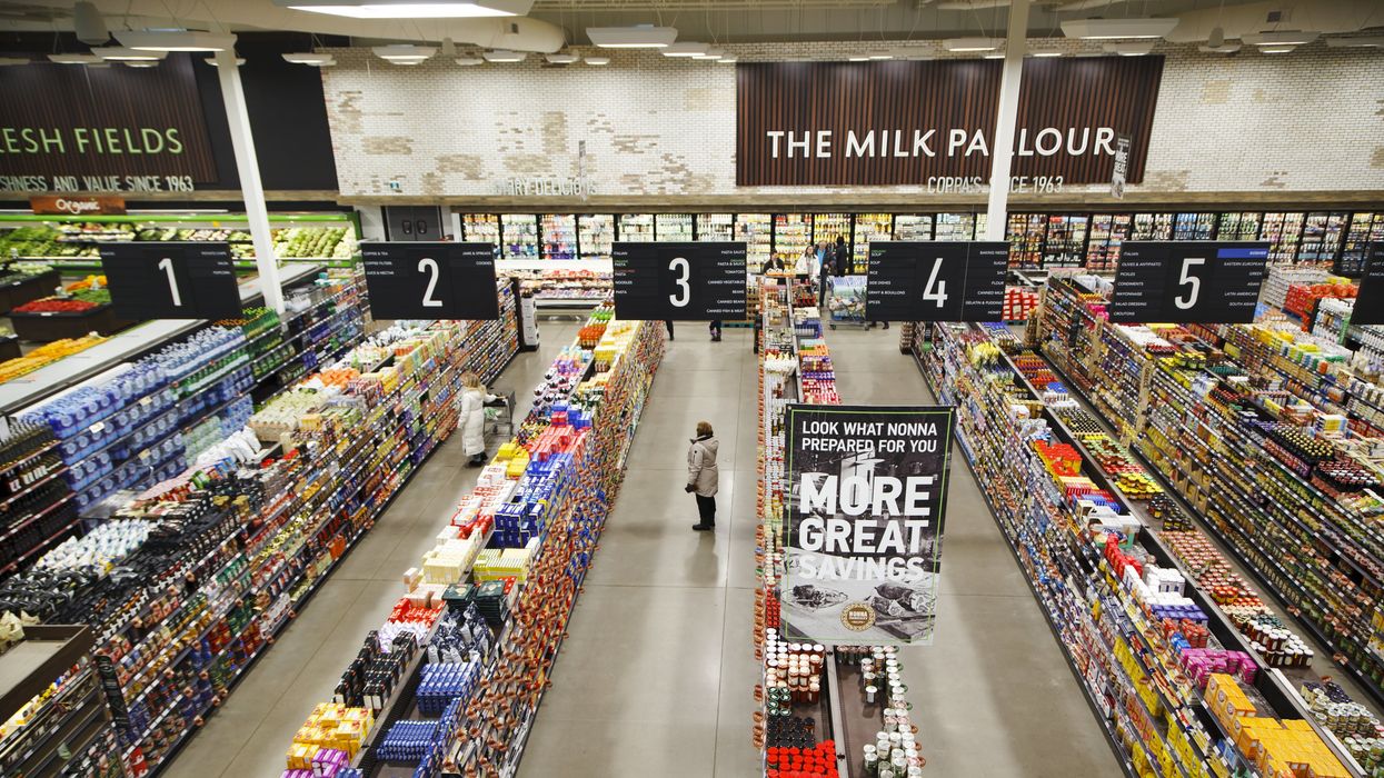 An overheard view of grocery store aisles.