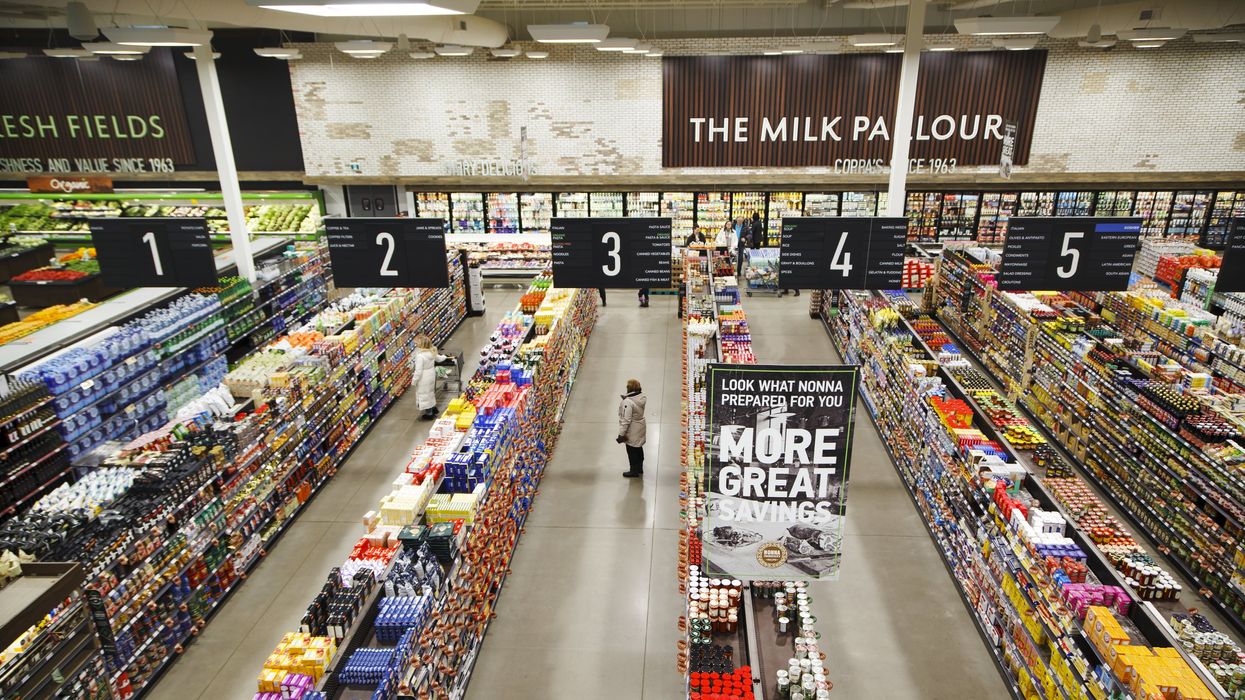 An overheard view of grocery store aisles.