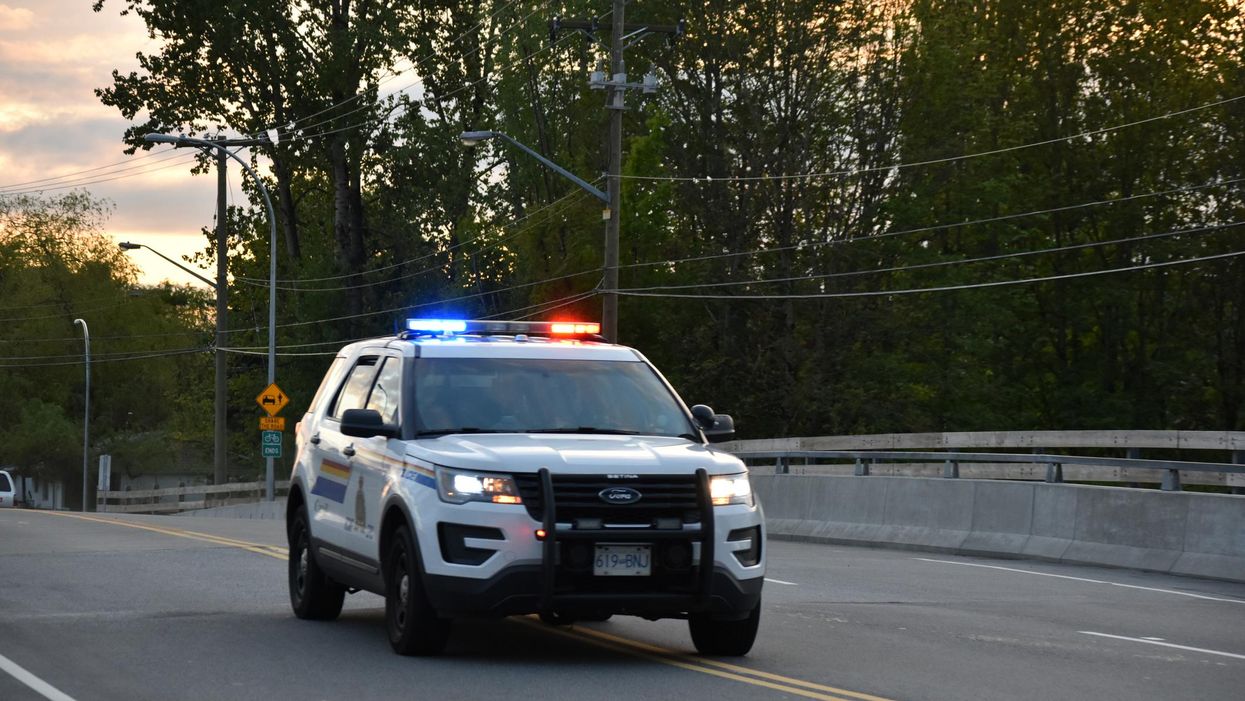 An RCMP vehicle with flashing lights.