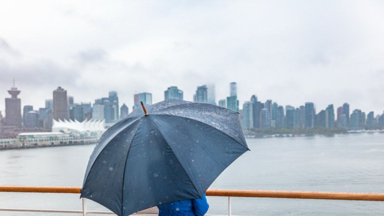 An umbrella in front of a city.