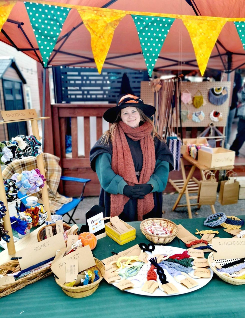 Artisan market vendor dressed like a witch.