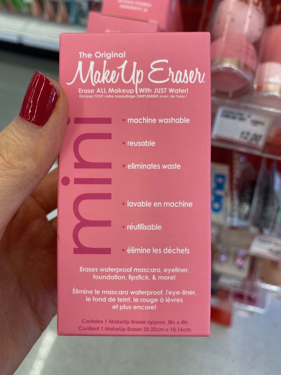 Asymina holding a pink box with the Original MakeUp Eraser inside.