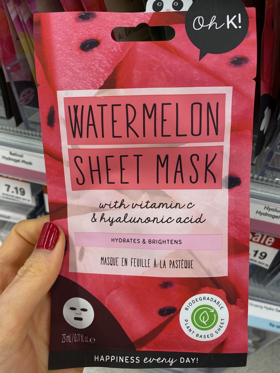 Asymina holding a sheet mask.