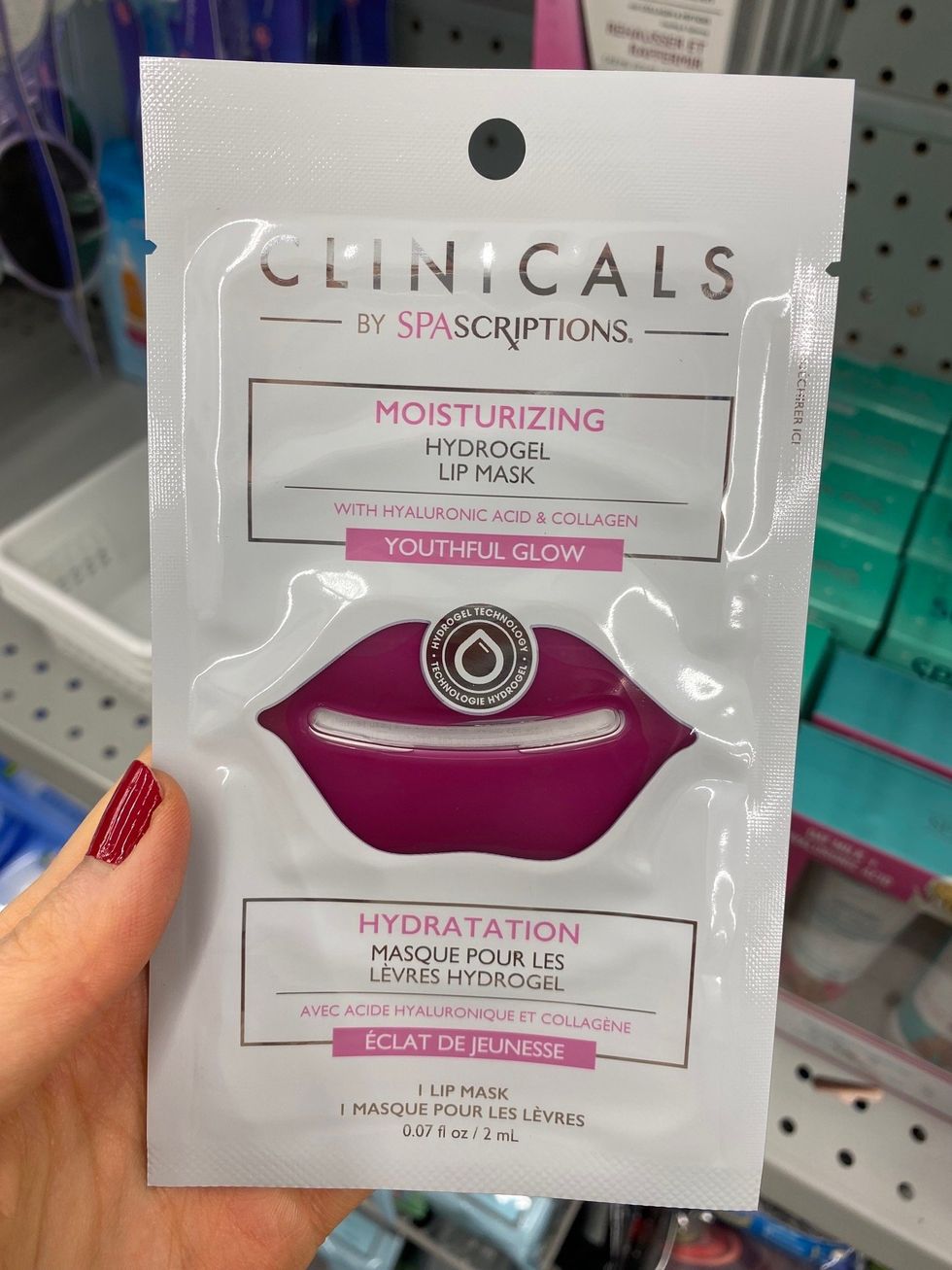 Asymina holding a white lip mask on sale at Dollarama.