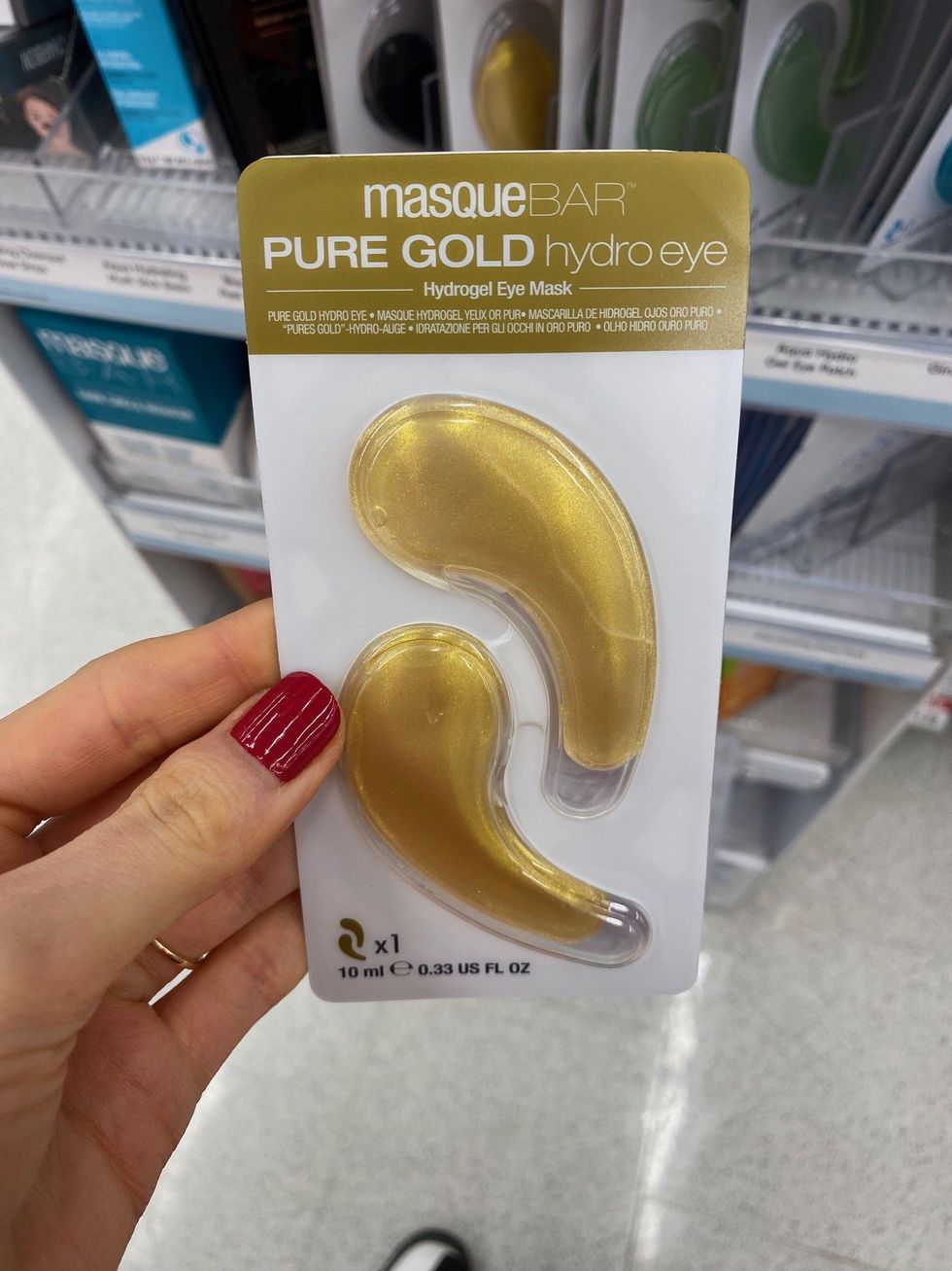 Asymina holding Masque Bar Pure Gold Hydrogel Eye Masks at Shoppers Drug Mart.