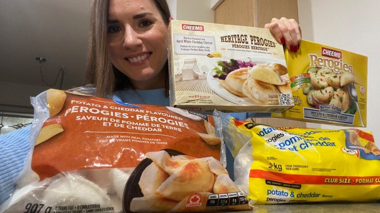 Asymina posing with different types of cheddar cheese pierogies.