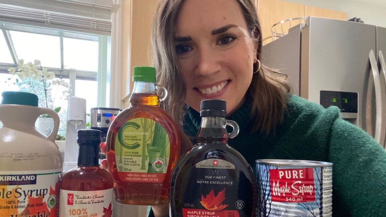 Asymina with five bottles of maple syrup.