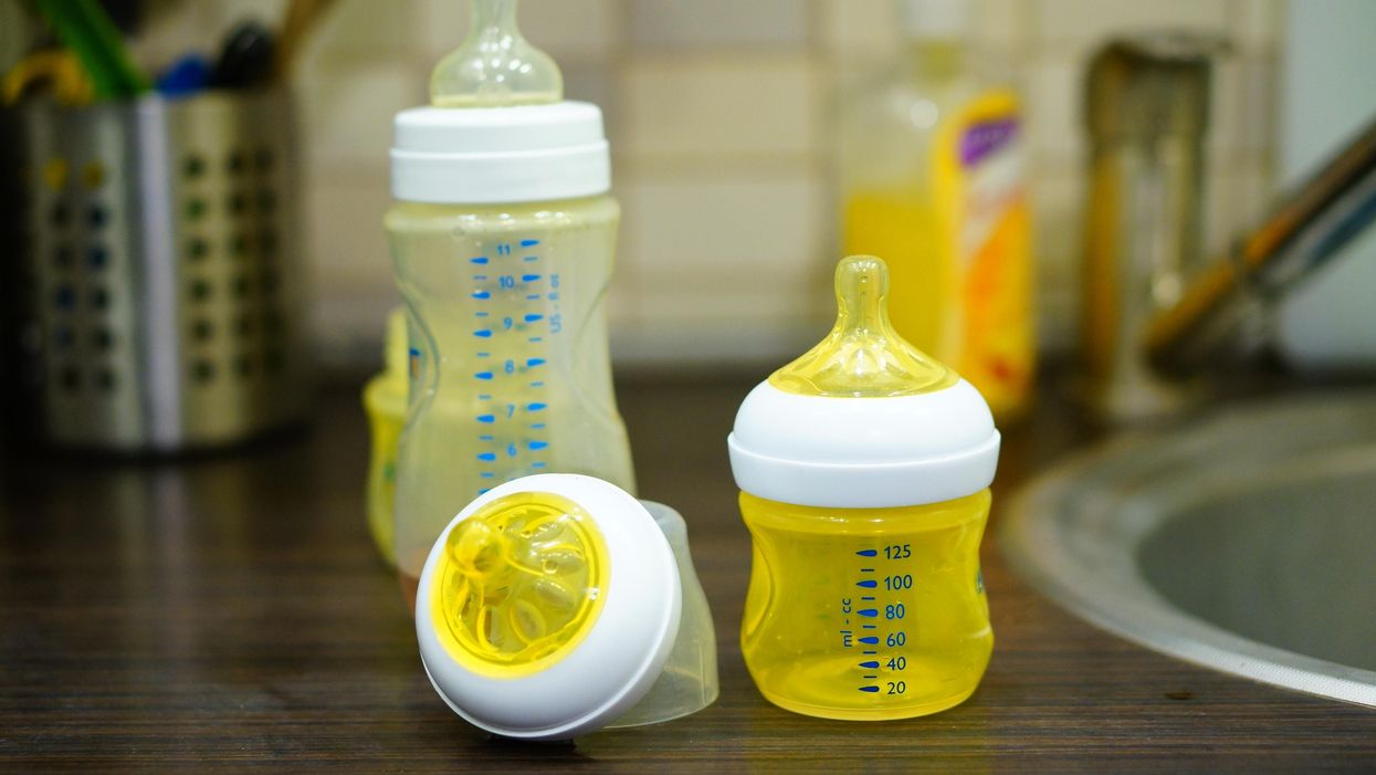 Baby bottles on a counter.