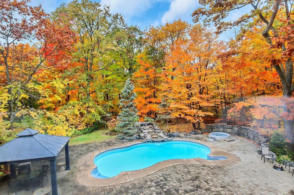 Backyard with pool and hot tub.