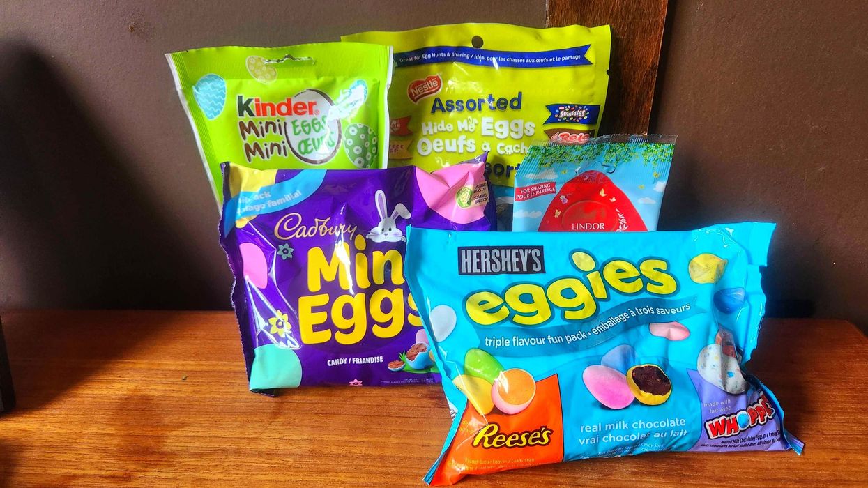 Bags of chocolate on a brown table.
