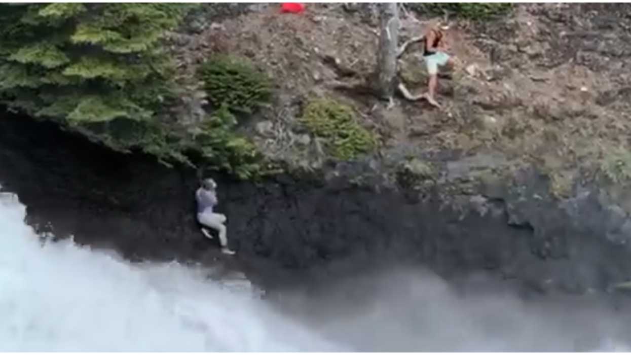 Banff Photo Stunt Off A Cliff & Above Rapids Looked Super Dangerous (VIDEO)