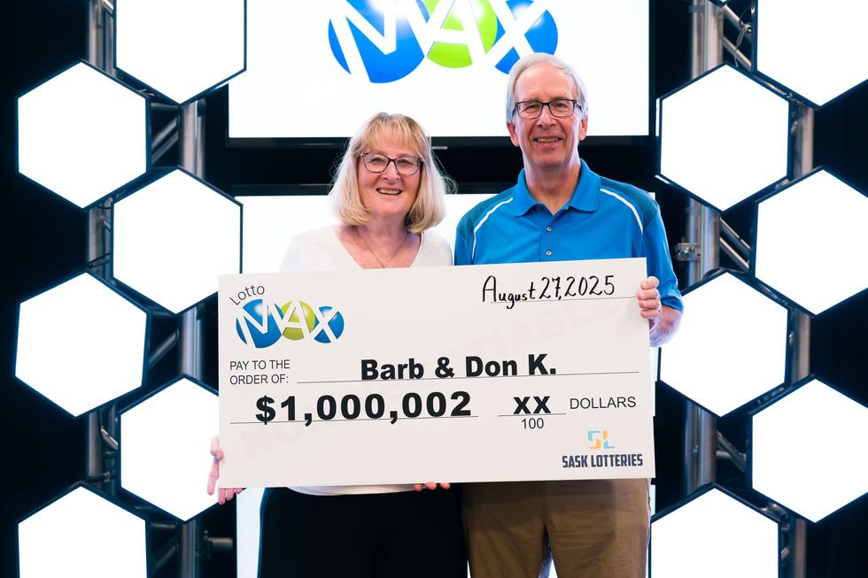 barb and don kostiuk holding a $1 million lotto max cheque