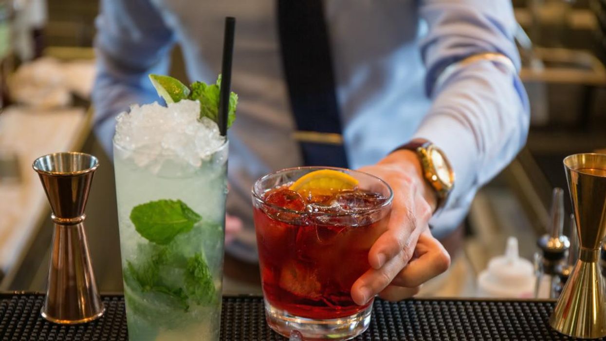 Bartender serving drinks.