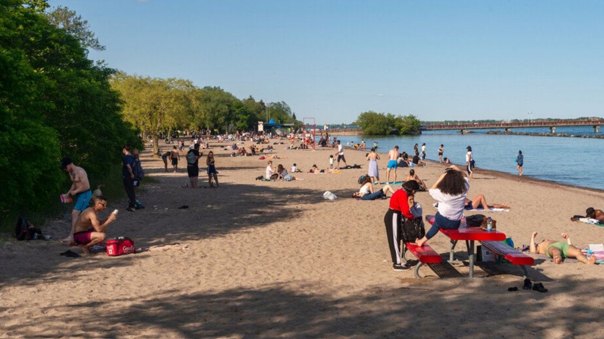 Beach-goers soaking up the sun on a hot summer day at Centre Island.