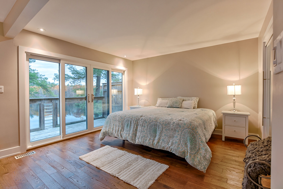 Bedroom with sliding door to a deck.