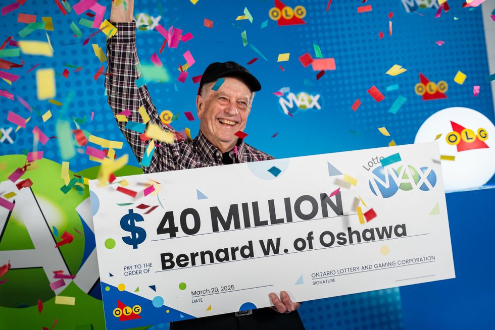 bernard white holding a $40 million lotto max cheque