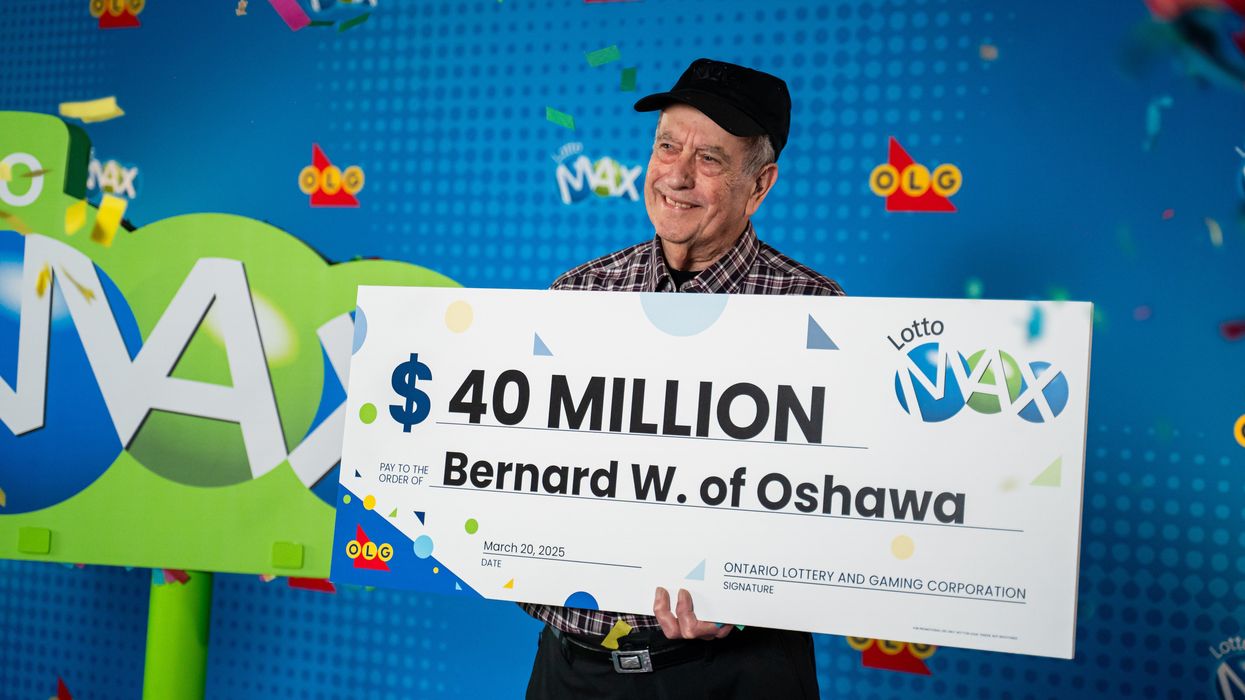bernard white holding a $40 million lotto max cheque