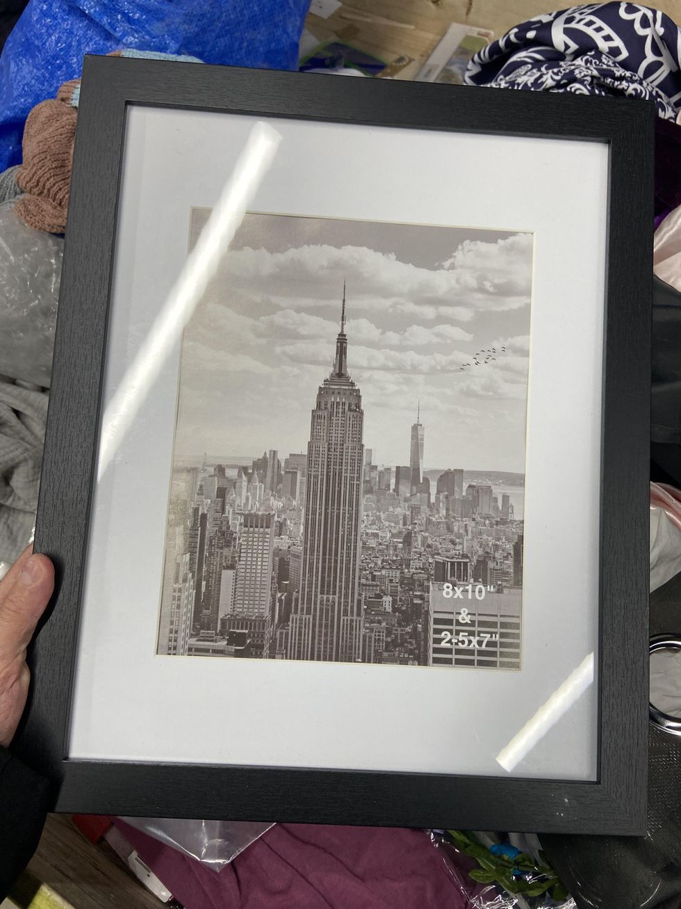 Black photo frame that fits an 8x10 picture.