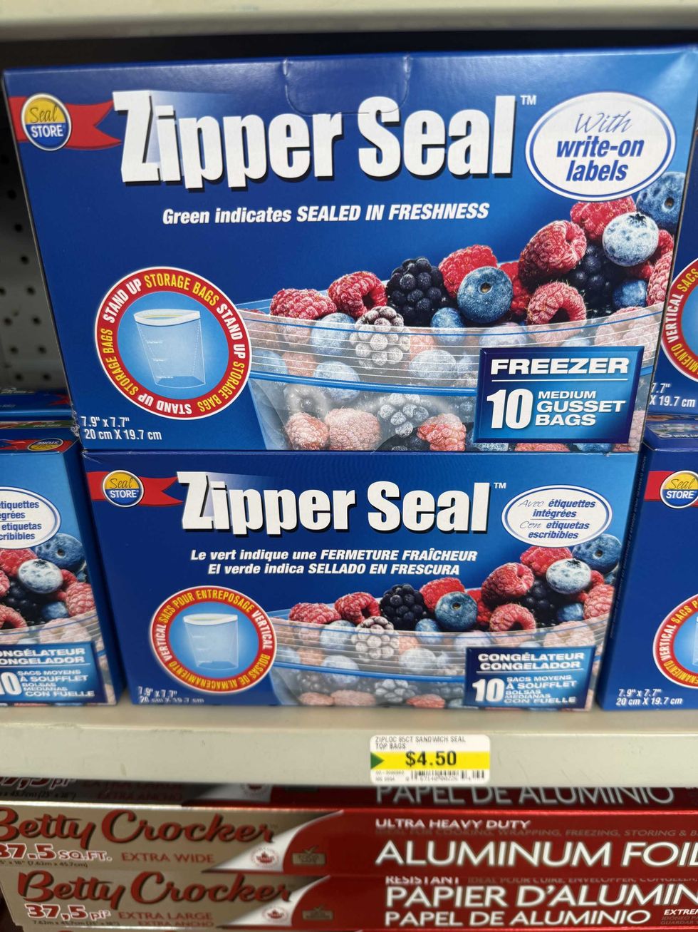 Blue boxes with a label reading Zipper Seal on the front and a photo with frozen berries inside a clear bag.