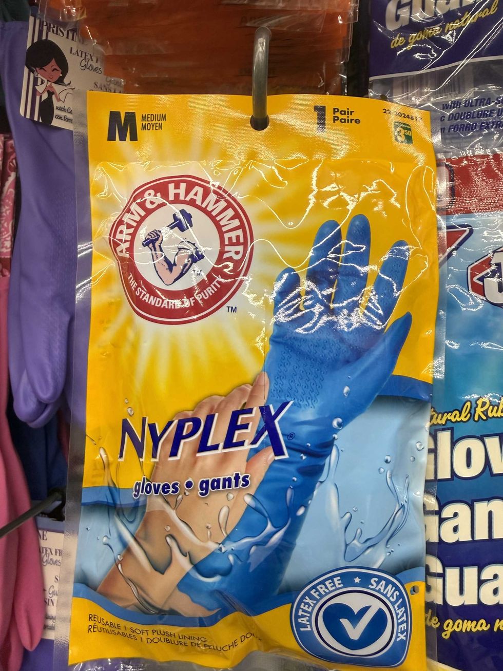 Blue rubber gloves inside a yellow and blue bag.