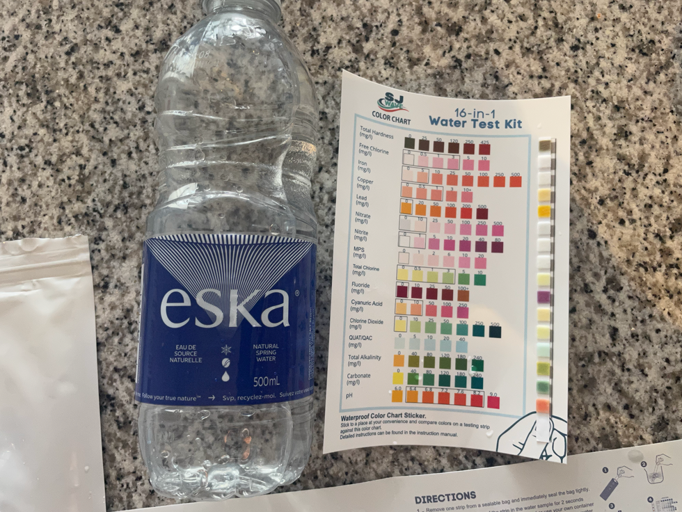 bottle of Eska water next to the results of the water test