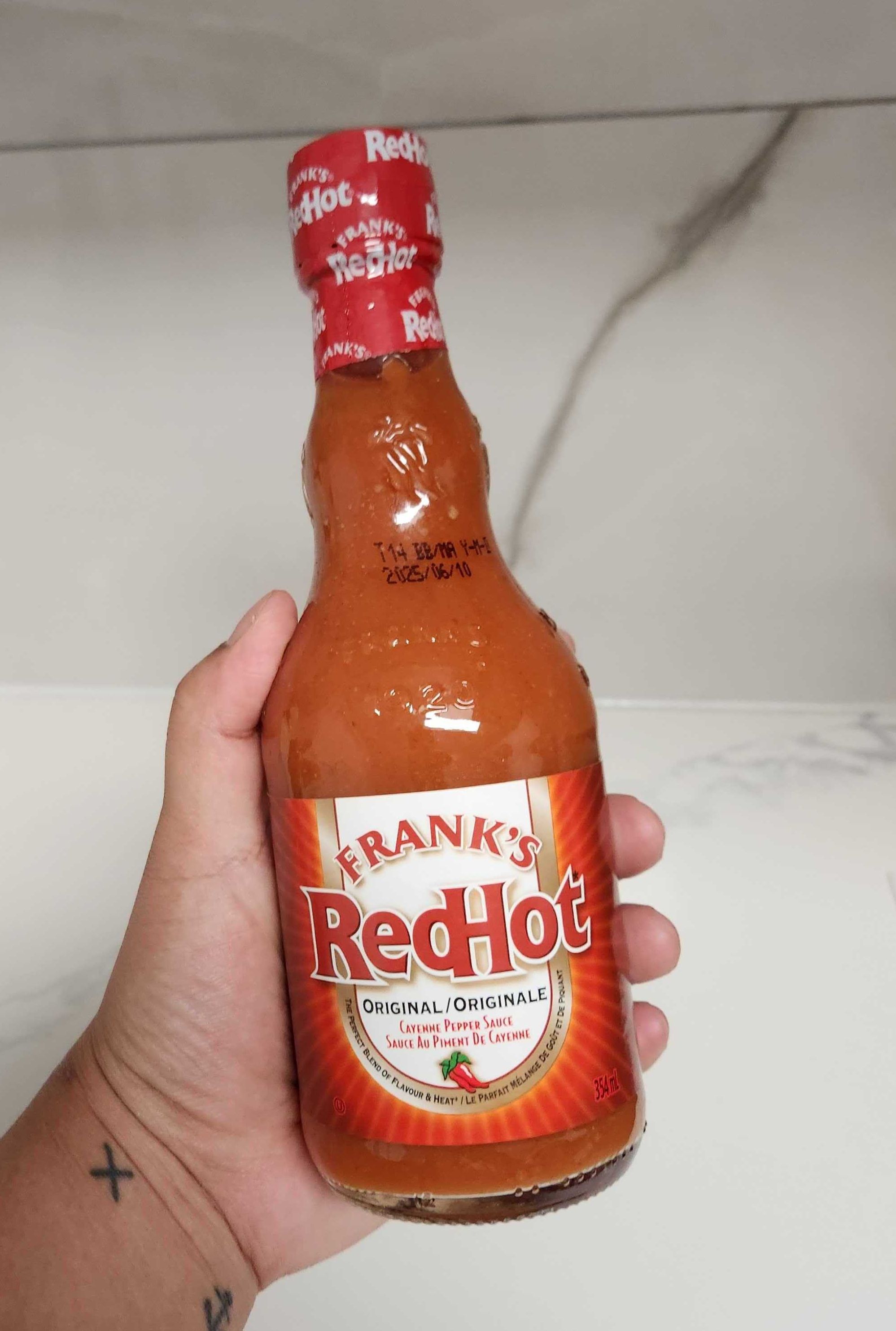 bottle of Frank's RedHot Original hot sauce.