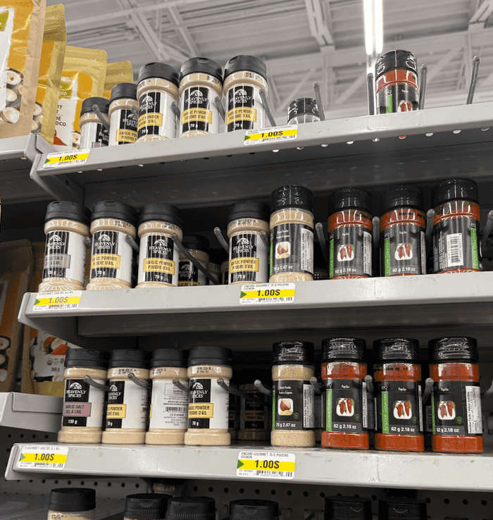 bottles of heavenly spices products including recalled garlic powder on shelves in dollarama store