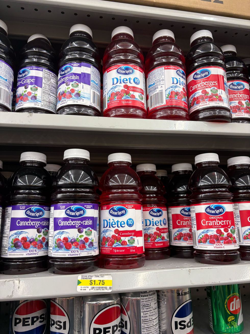 bottles of ocean spray cranberry juice on shelves at dollarama