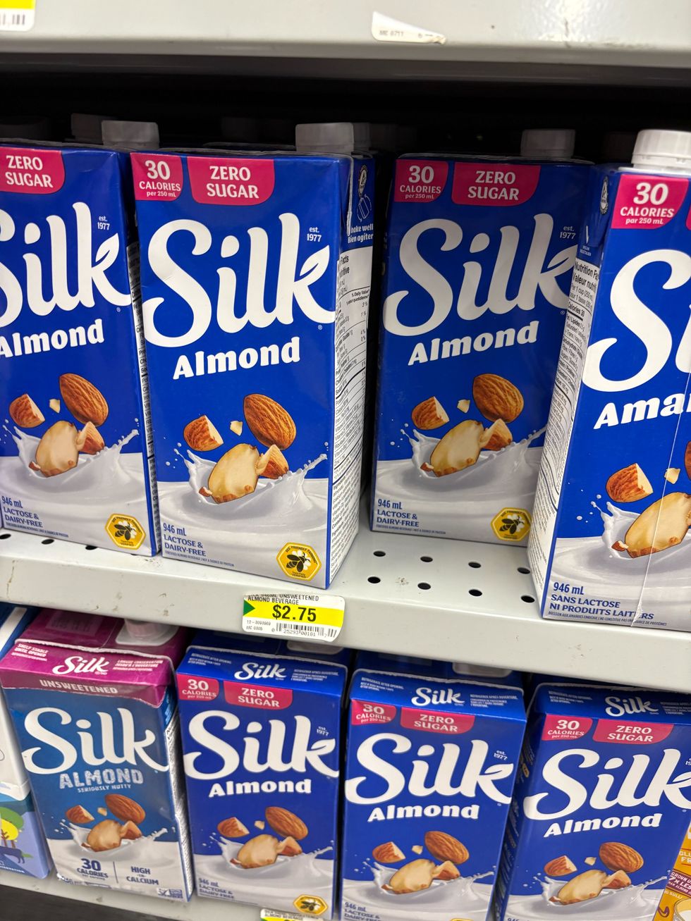 bottles of silk almond beverage on shelves at dollarama