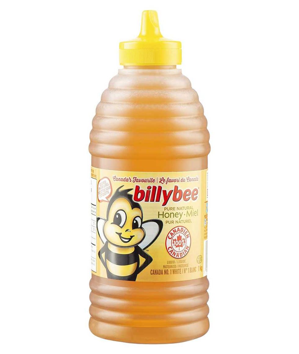 Bouteille de miel de 1 kg de marque Billy Bee sur fond blanc.