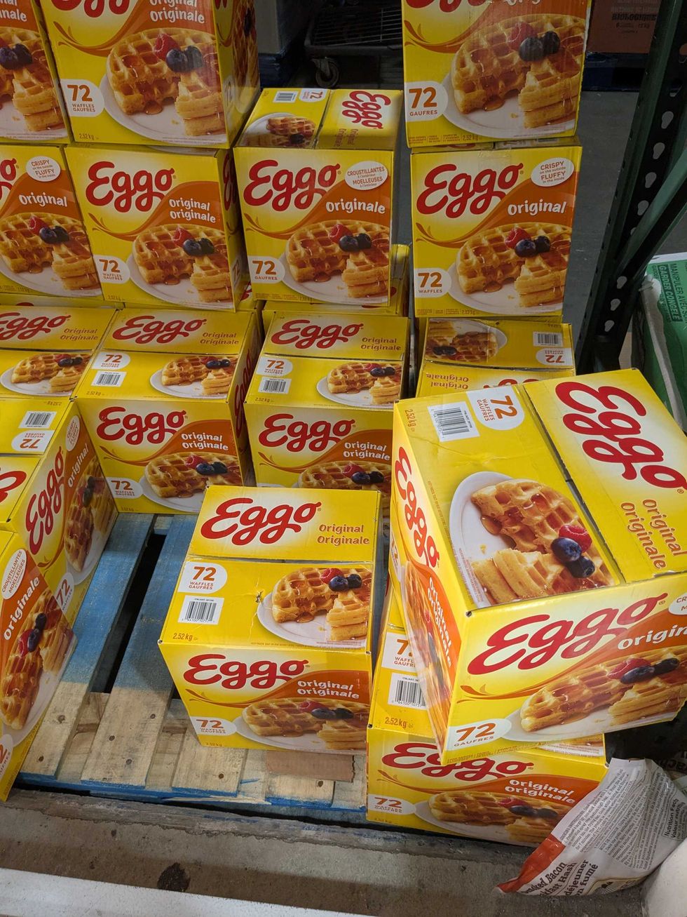 Boxes of Eggo waffles stacked on a pallet in Costco