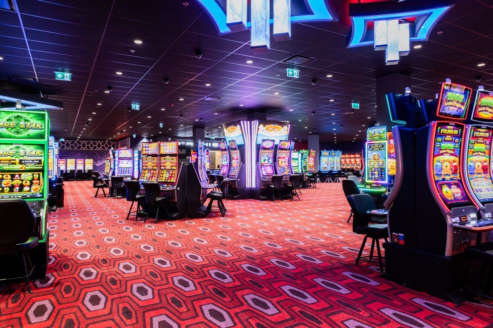Bright casino floor with slot machines